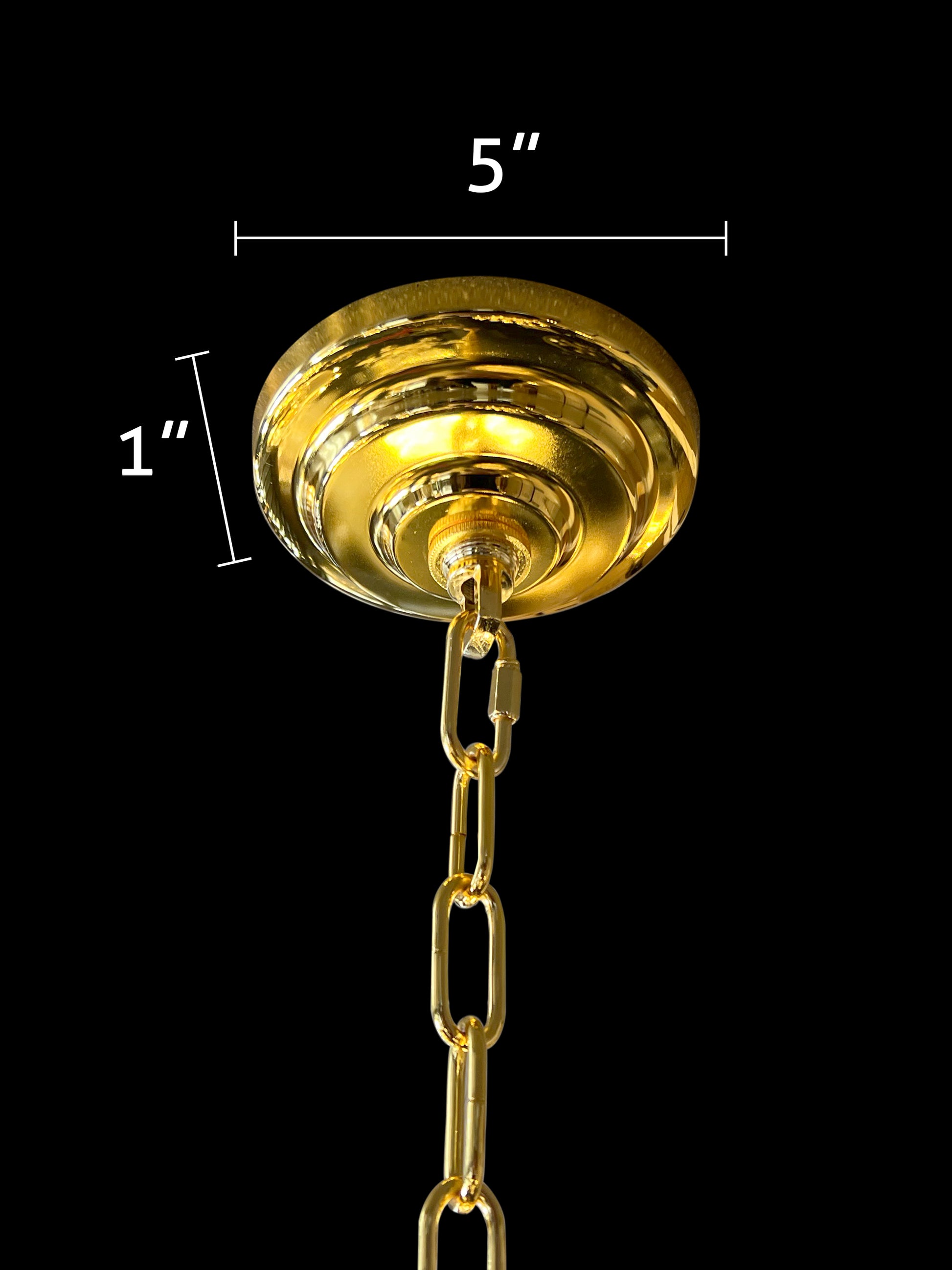 Close-up of gold chandelier canopy and adjustable hanging chain detail.