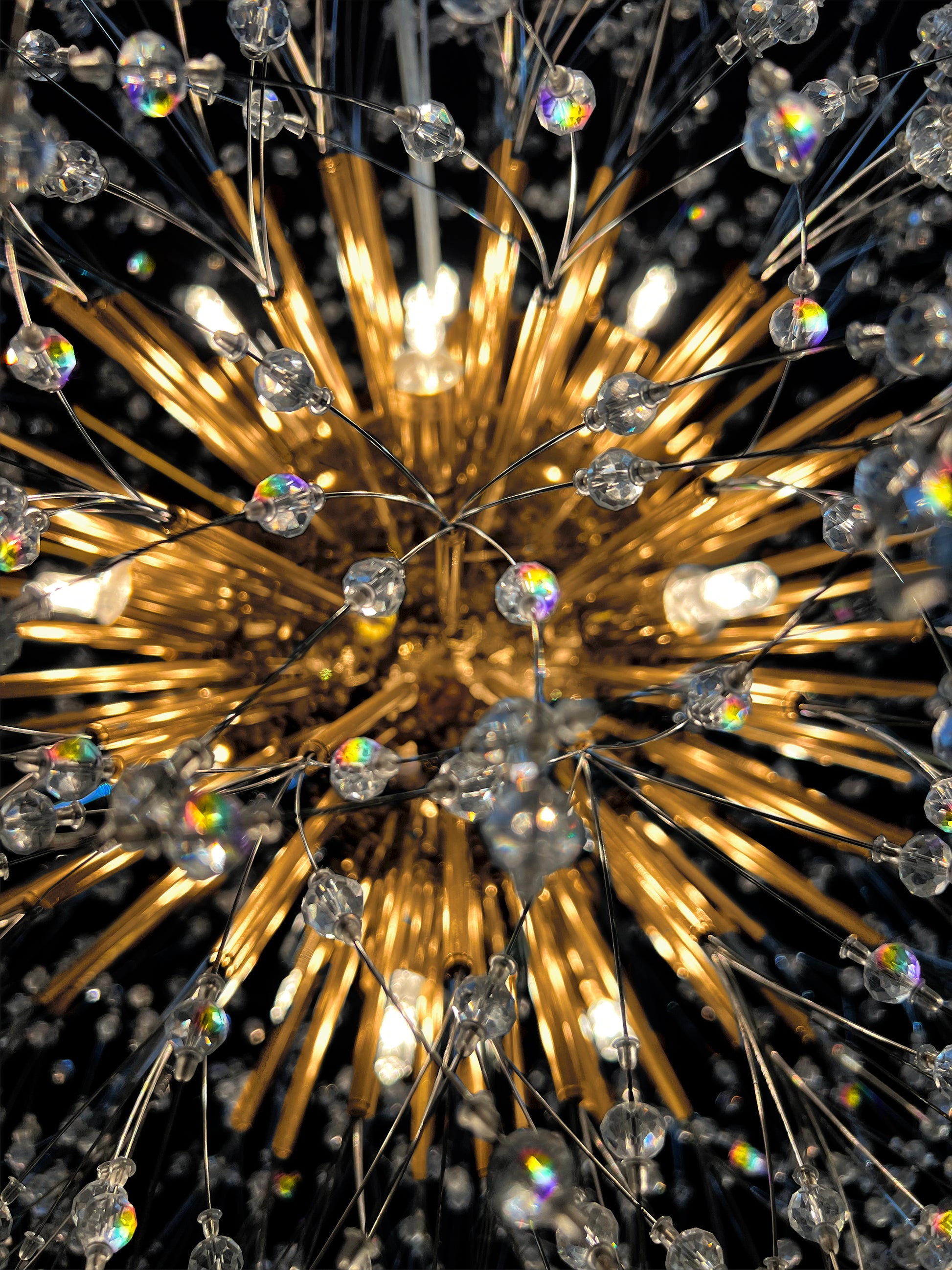 Close-up view of gold chandelier crystal branches