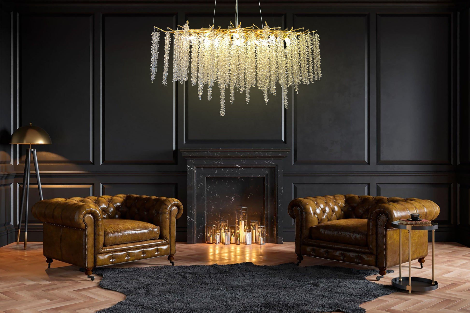 A luxurious gold crystal raindrop chandelier hanging from the ceiling, with a branch-inspired design, displayed in a room with two leather chairs and a fireplace in the background.
