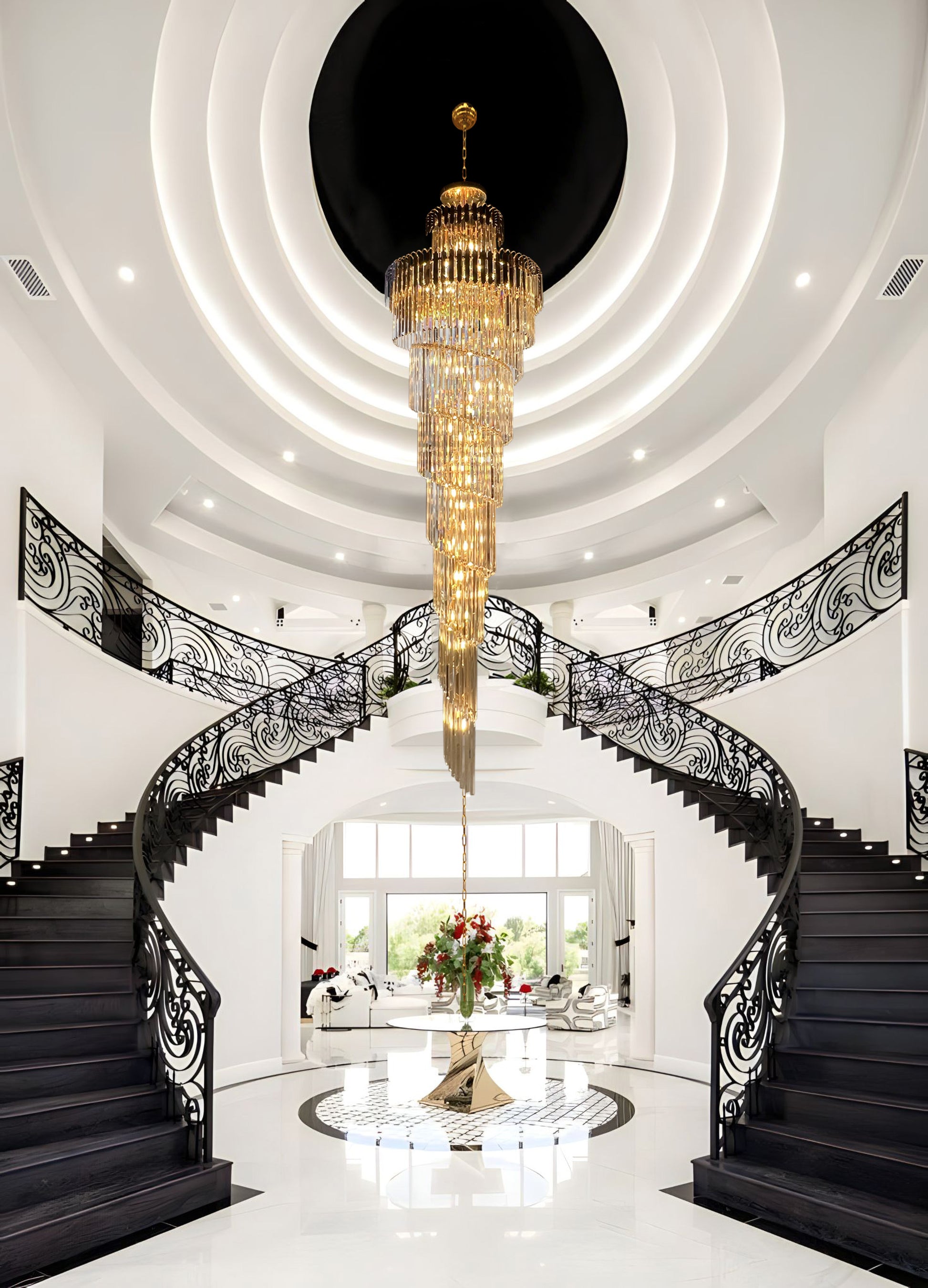 Elegant gold crystal chandelier illuminating grand staircase.
