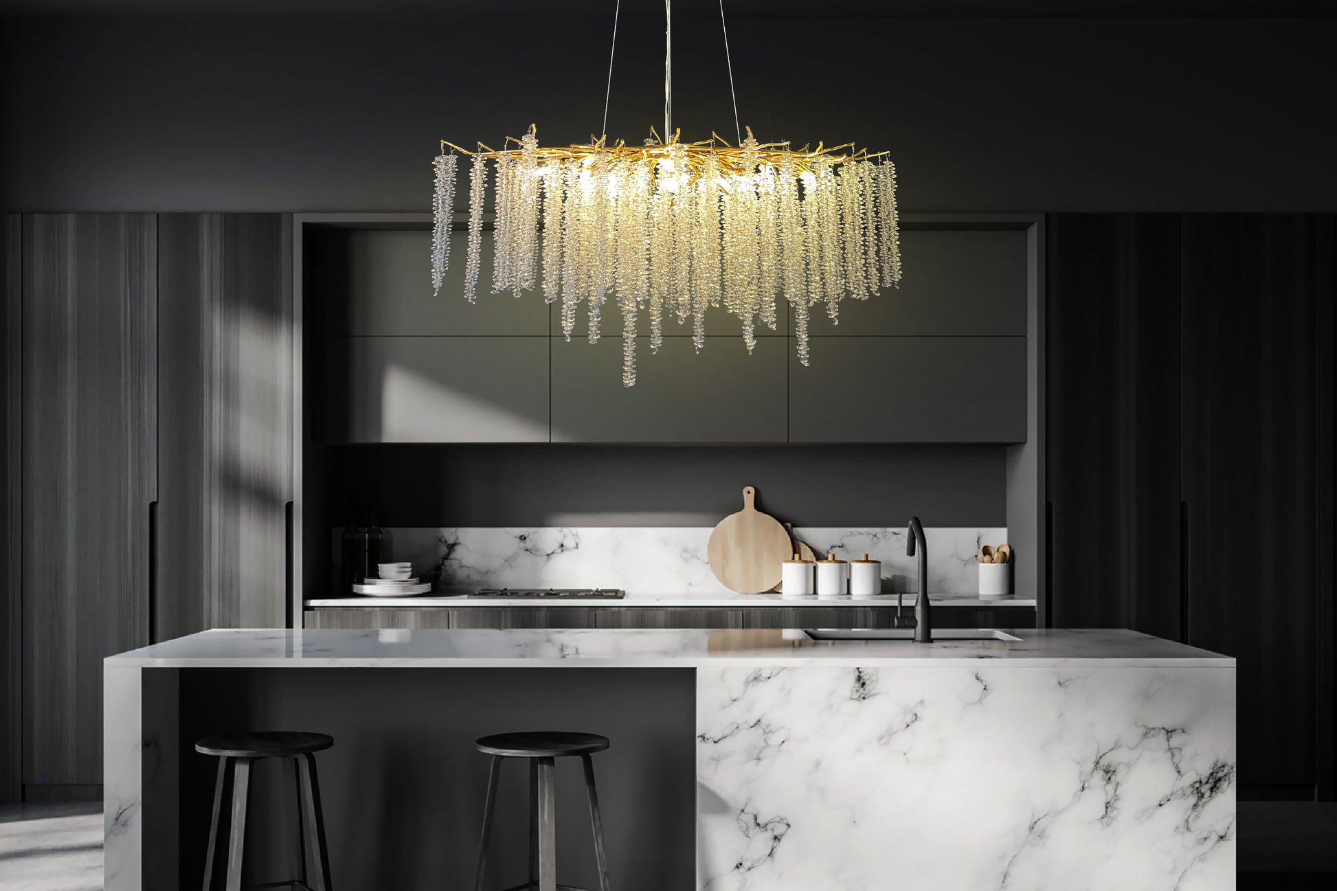 Linear dimmable crystal chandelier illuminating kitchen island