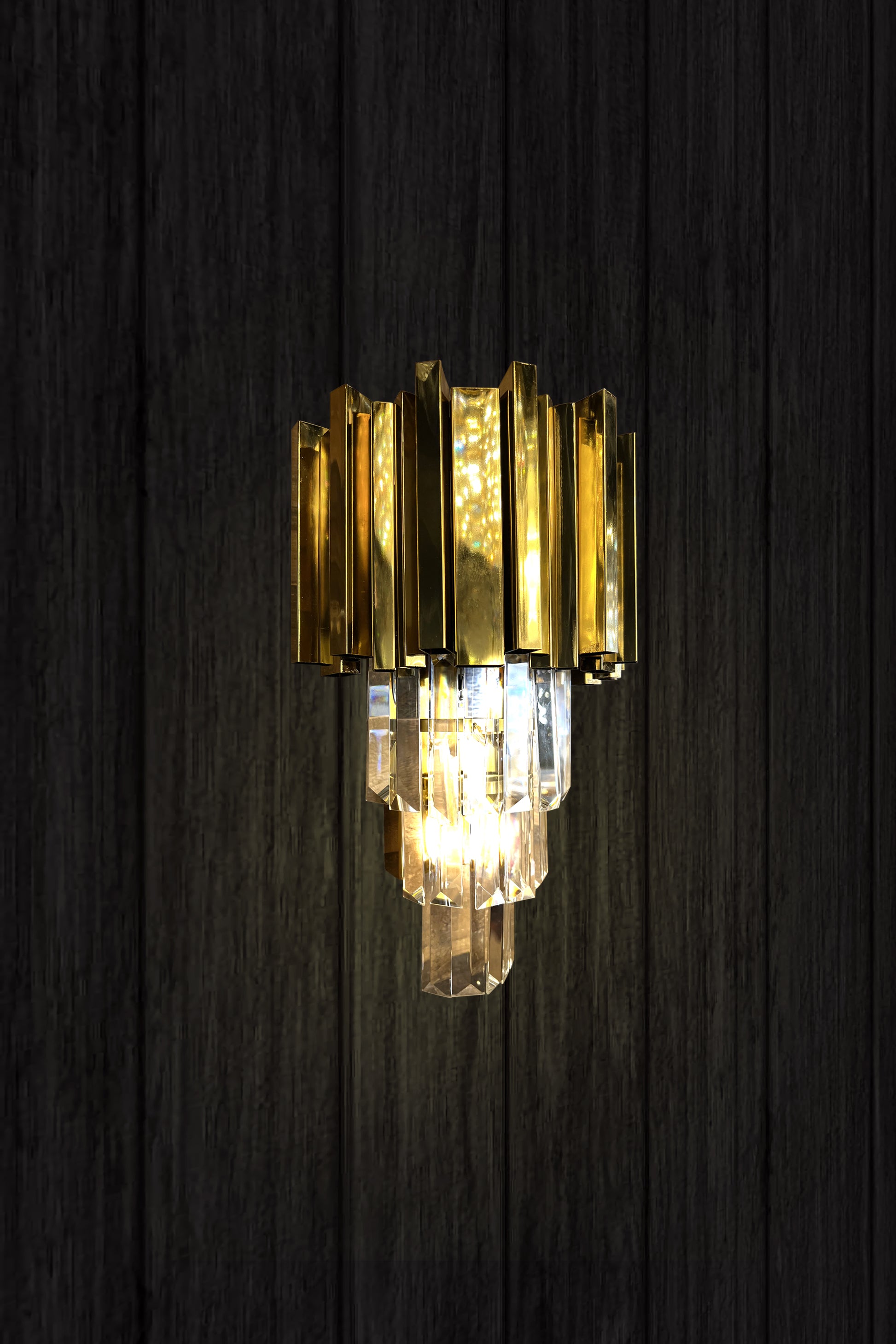 vertical shot of gold crystal wall light
