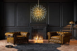 Modern gold glass chandelier adding elegance to contemporary décor.