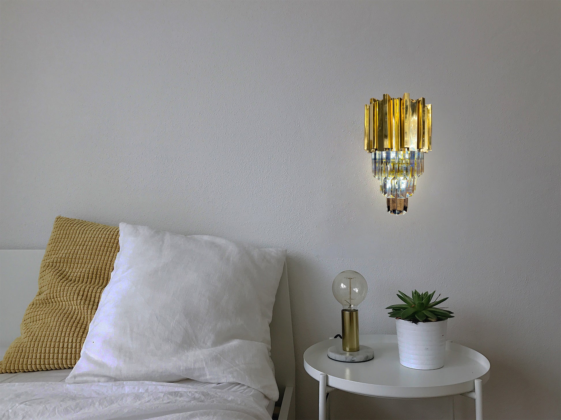  gold LED wall sconce beside modern bedroom nightstand