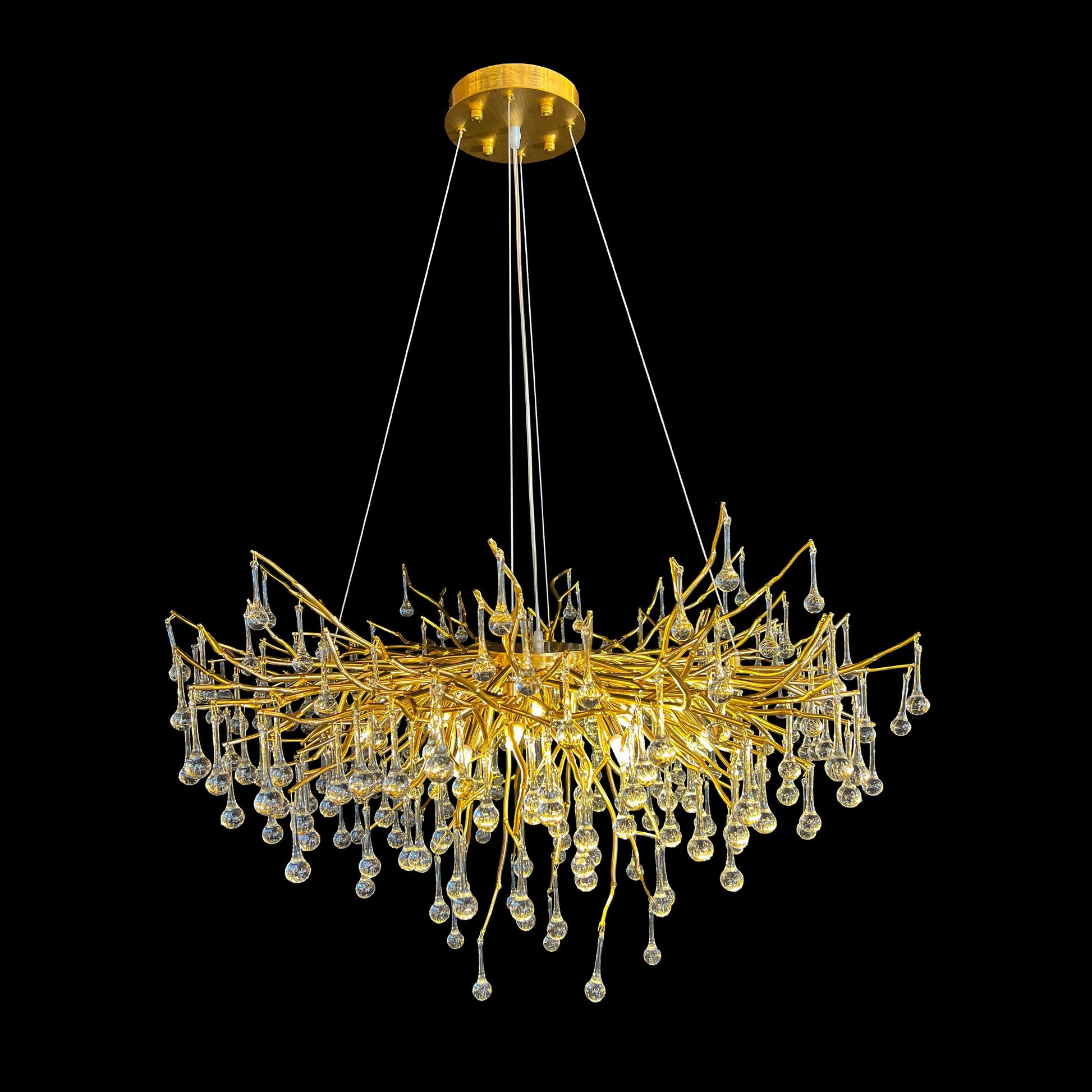 Modern gold crystal chandelier with branch design and hanging teardrop crystals