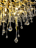 Bottom view of gold branch chandelier with hanging glass drops