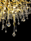 Bottom view of gold branch chandelier with hanging glass drops