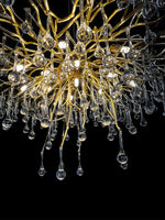 Close-up detail of gold metal branches with glass drops