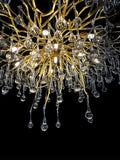 Close-up detail of gold metal branches with glass drops