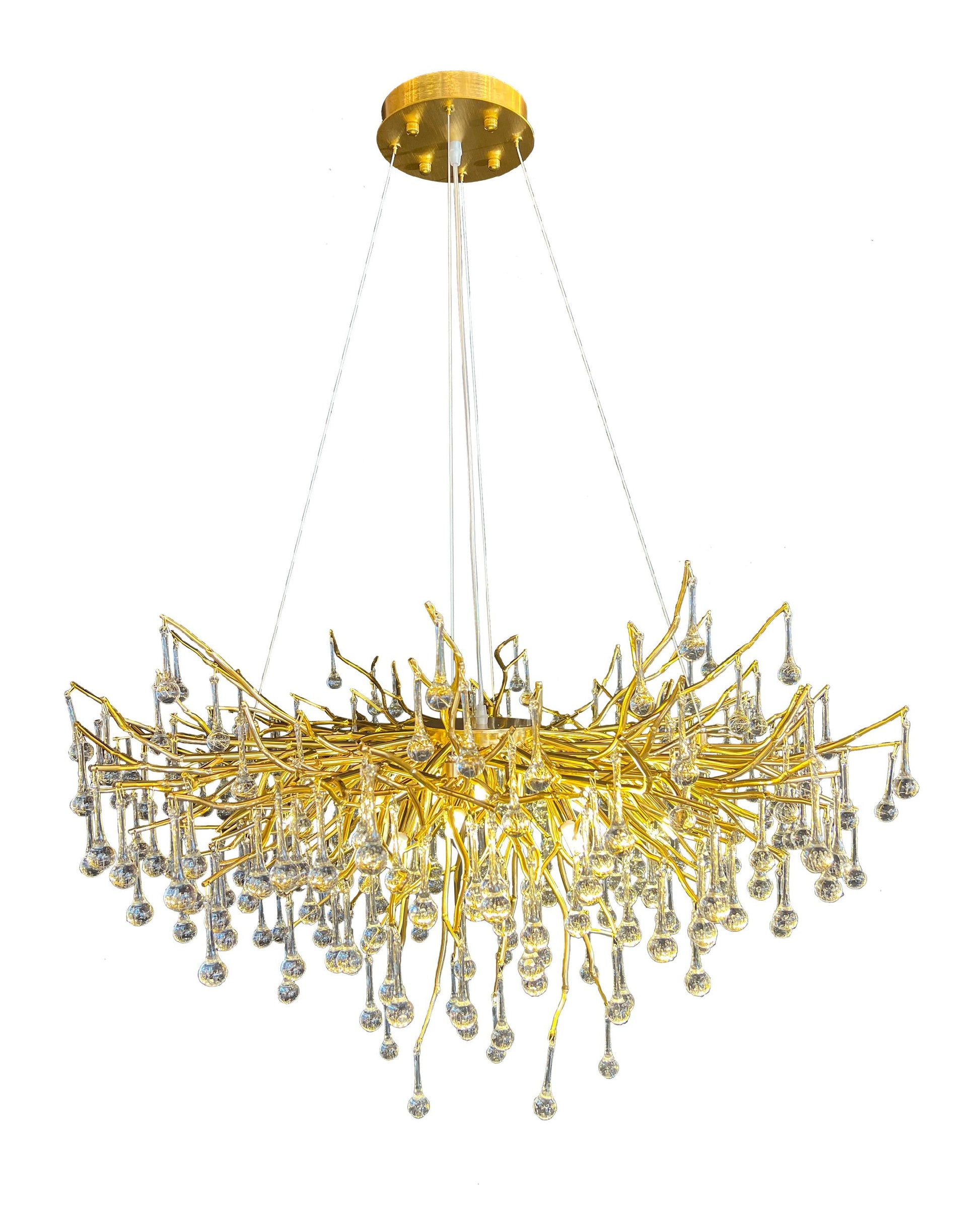 Side profile view of gold glass branch chandelier