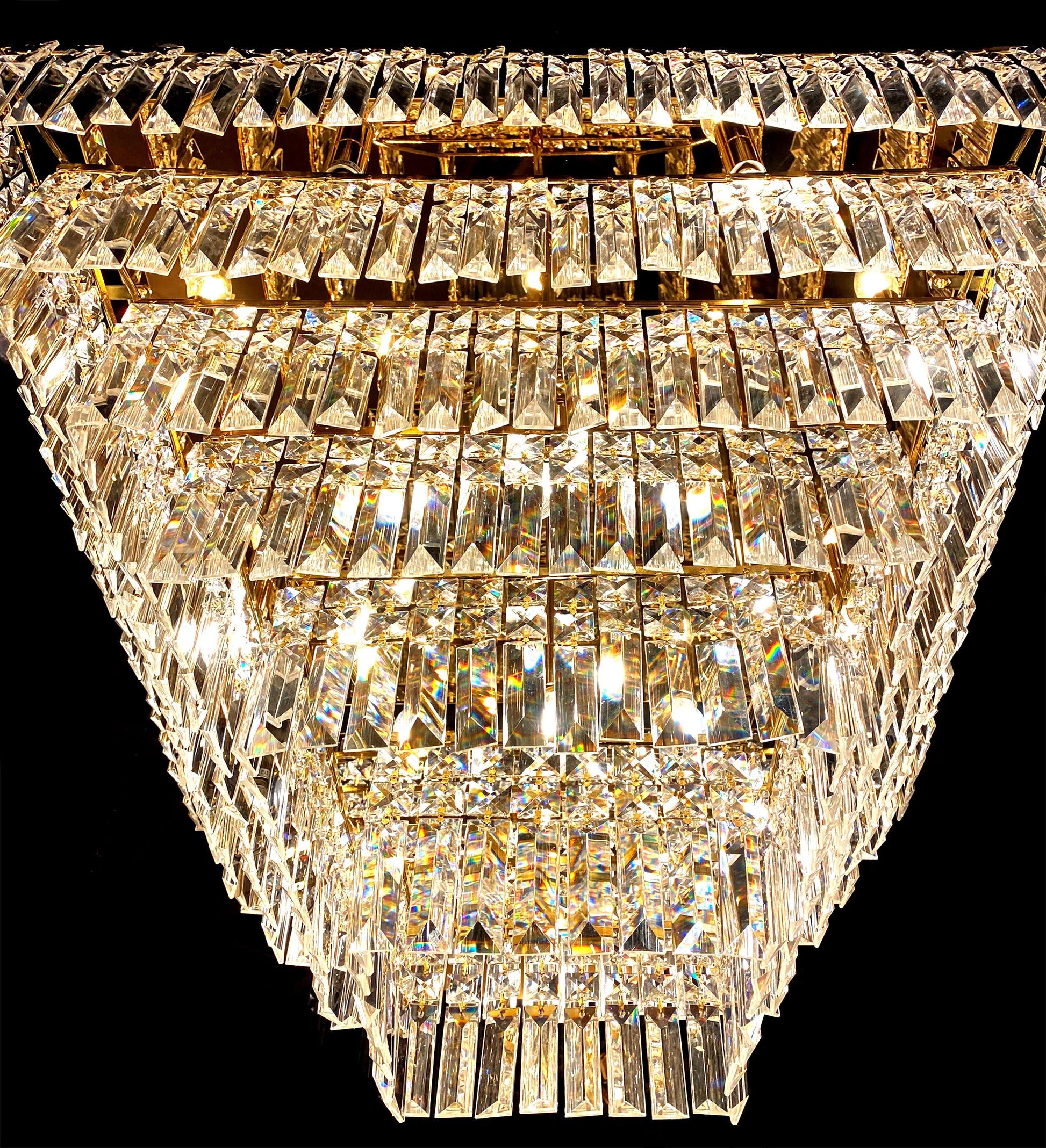 Clear lead crystal prism detail on gold tiered chandelier