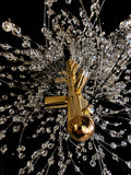 Precision-cut crystal branches detail on modern gold chandelier
