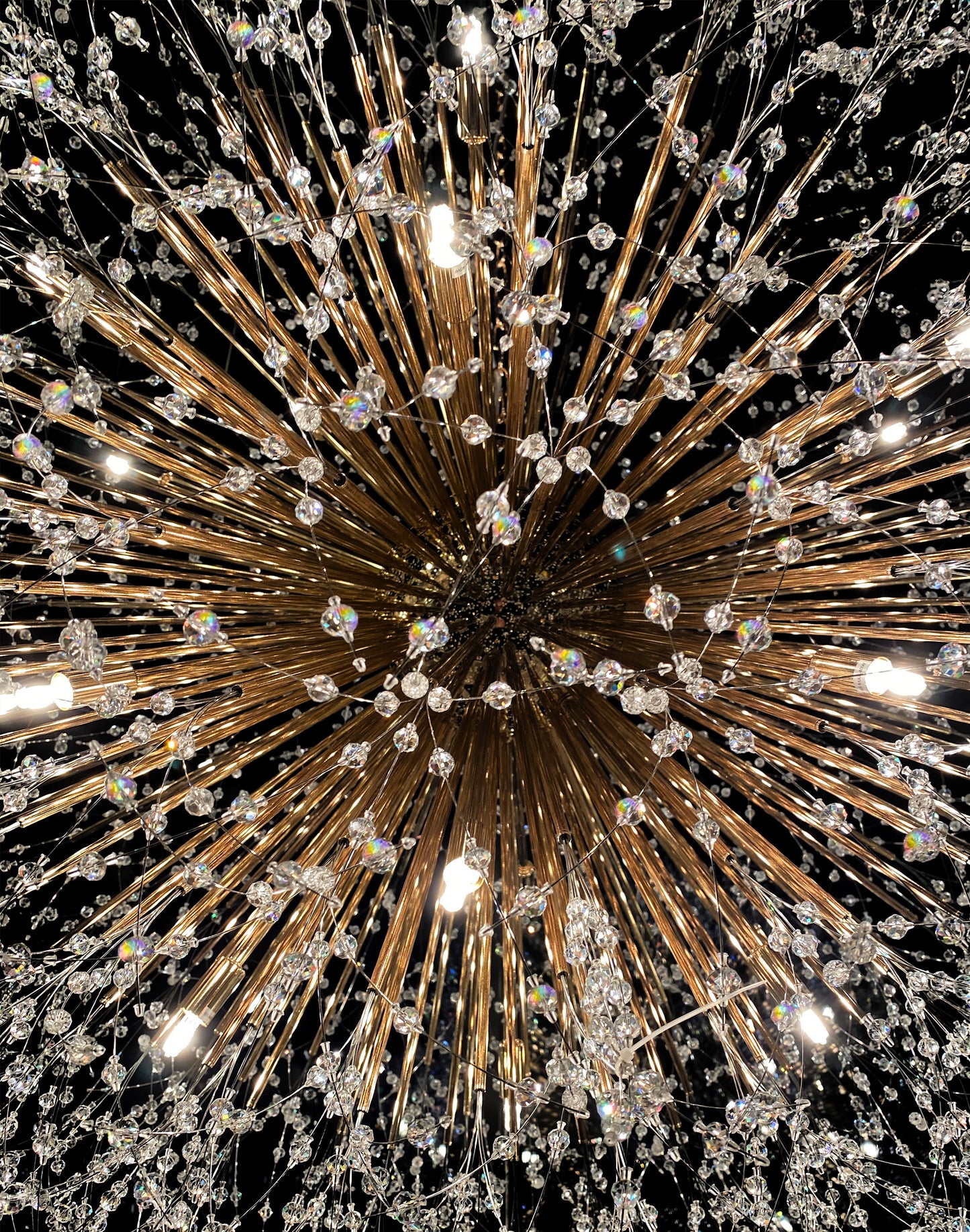 Handcrafted crystal branches with gold finish reflecting warm light