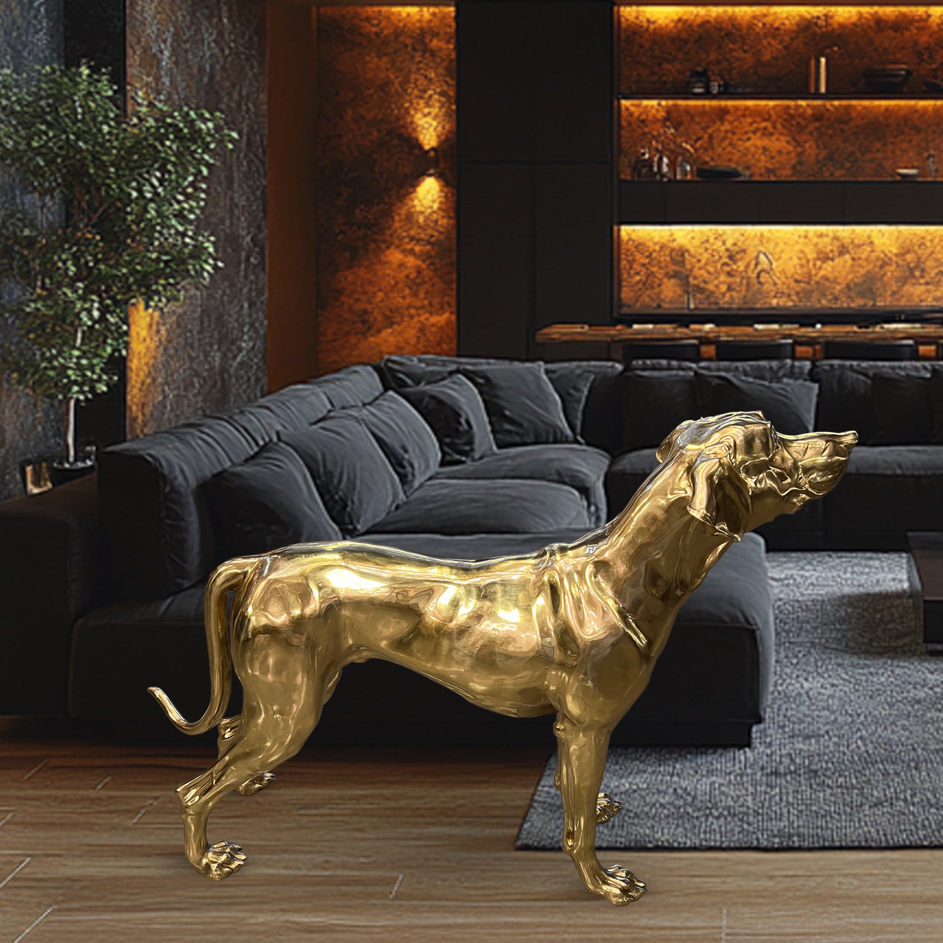 A life-size sculpture of a Golden Pointer dog made from brass and bronze, displayed in a luxurious living room setting.