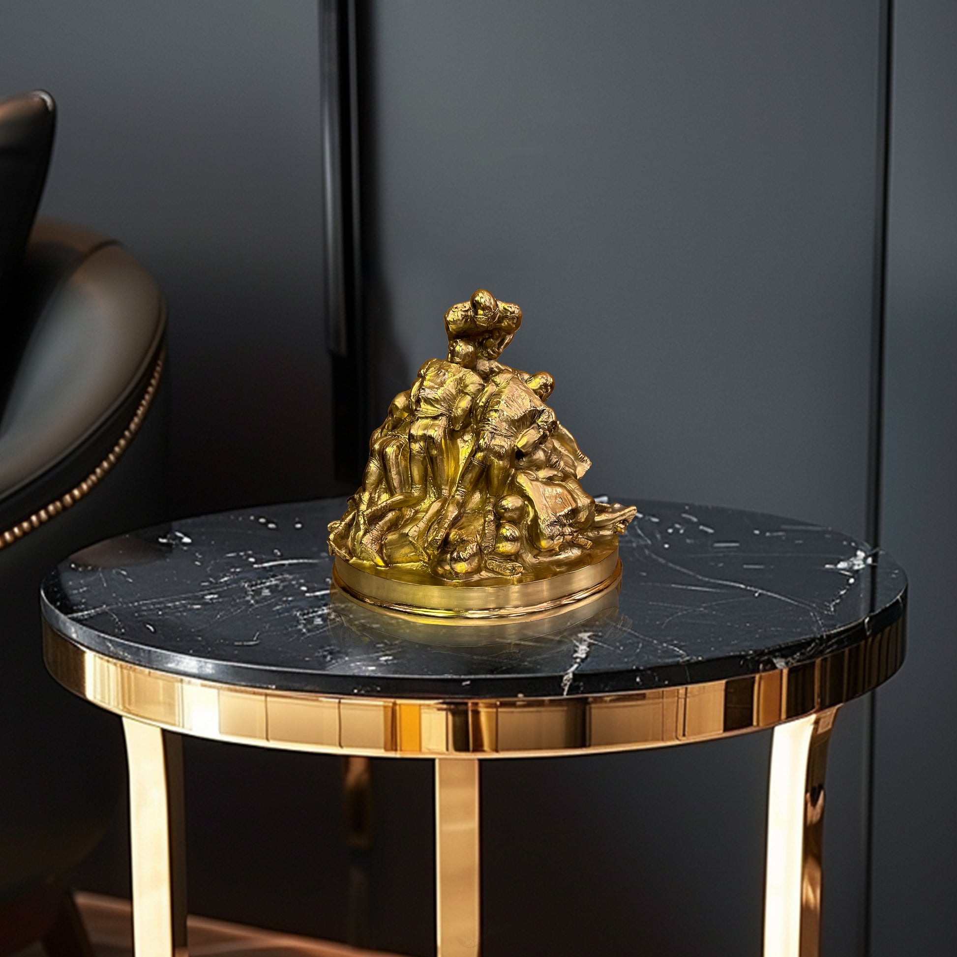 Luxury solid brass American football sculpture displayed on a marble table as a high-end decorative accent.