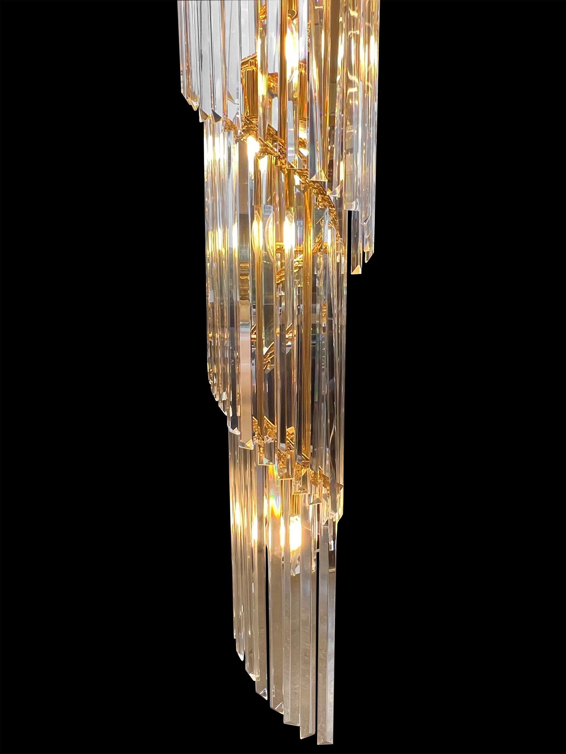  Luxury spiral gold crystal chandelier with cascading full-lead crystals creating elegant vertical glow.