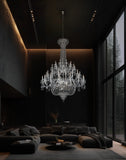 Modern chrome empire chandelier enhancing a high-ceiling foyer with elegant lighting