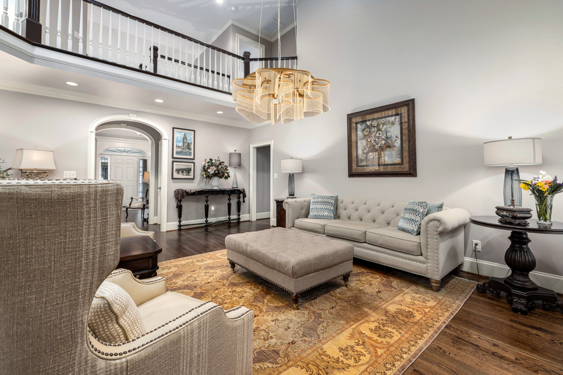 Elegant gold LED chandelier illuminating contemporary living room