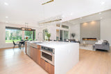 Modern gold crystal starburst chandelier with sculpted crystal branches in kitchen 