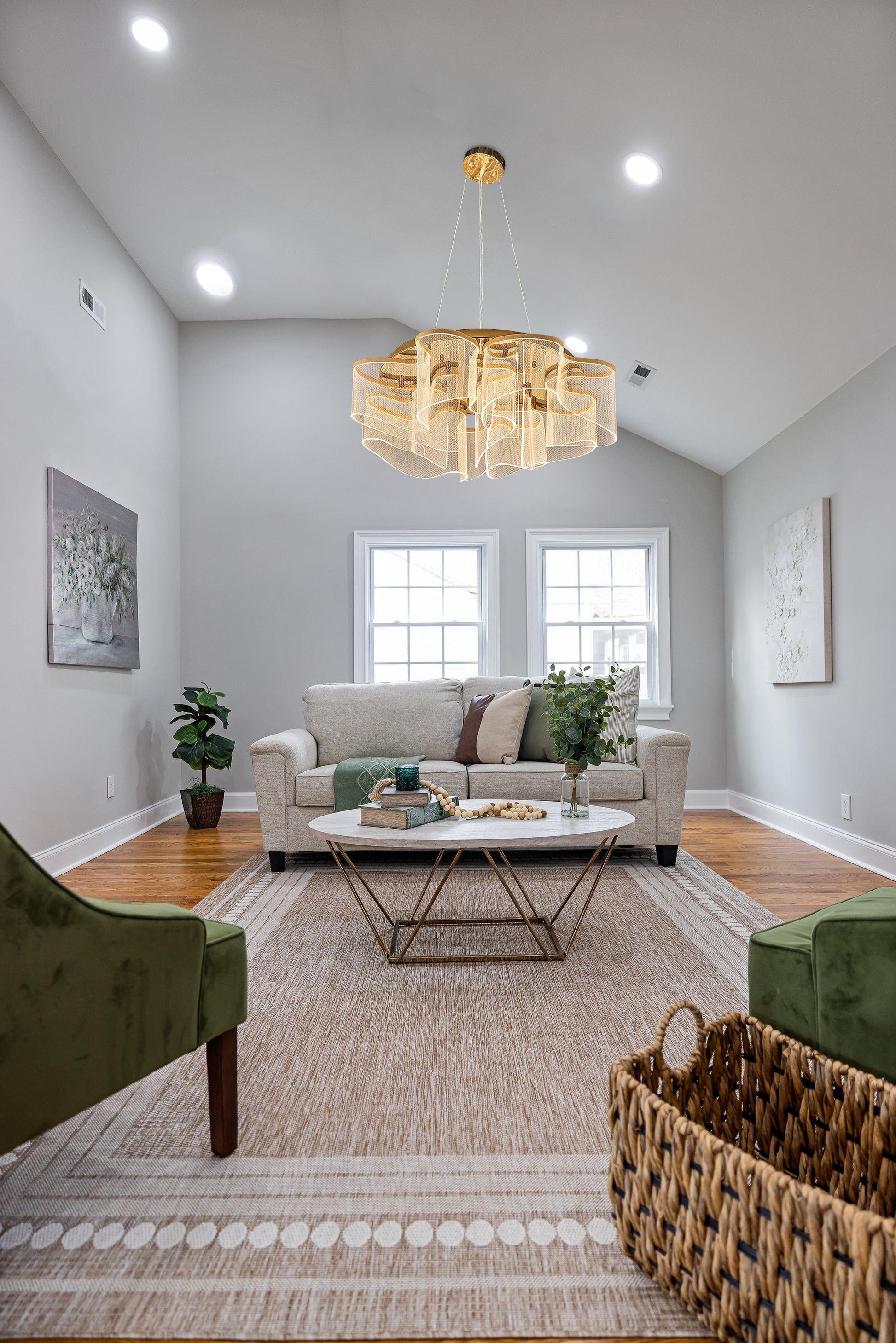 Elegant gold LED chandelier illuminating contemporary family  room