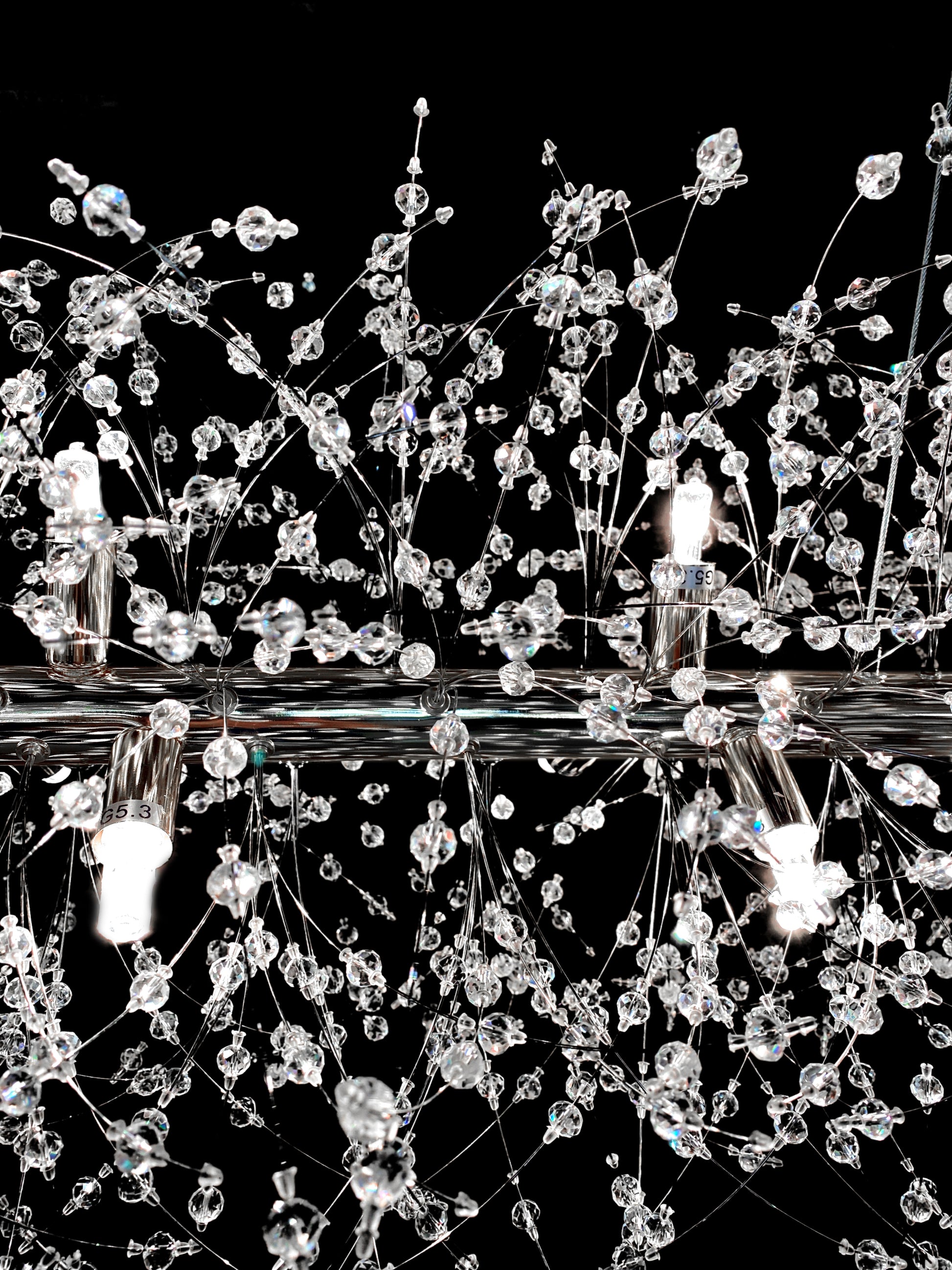 Close-up of dimmable linear crystal chandelier with G9 bulbs