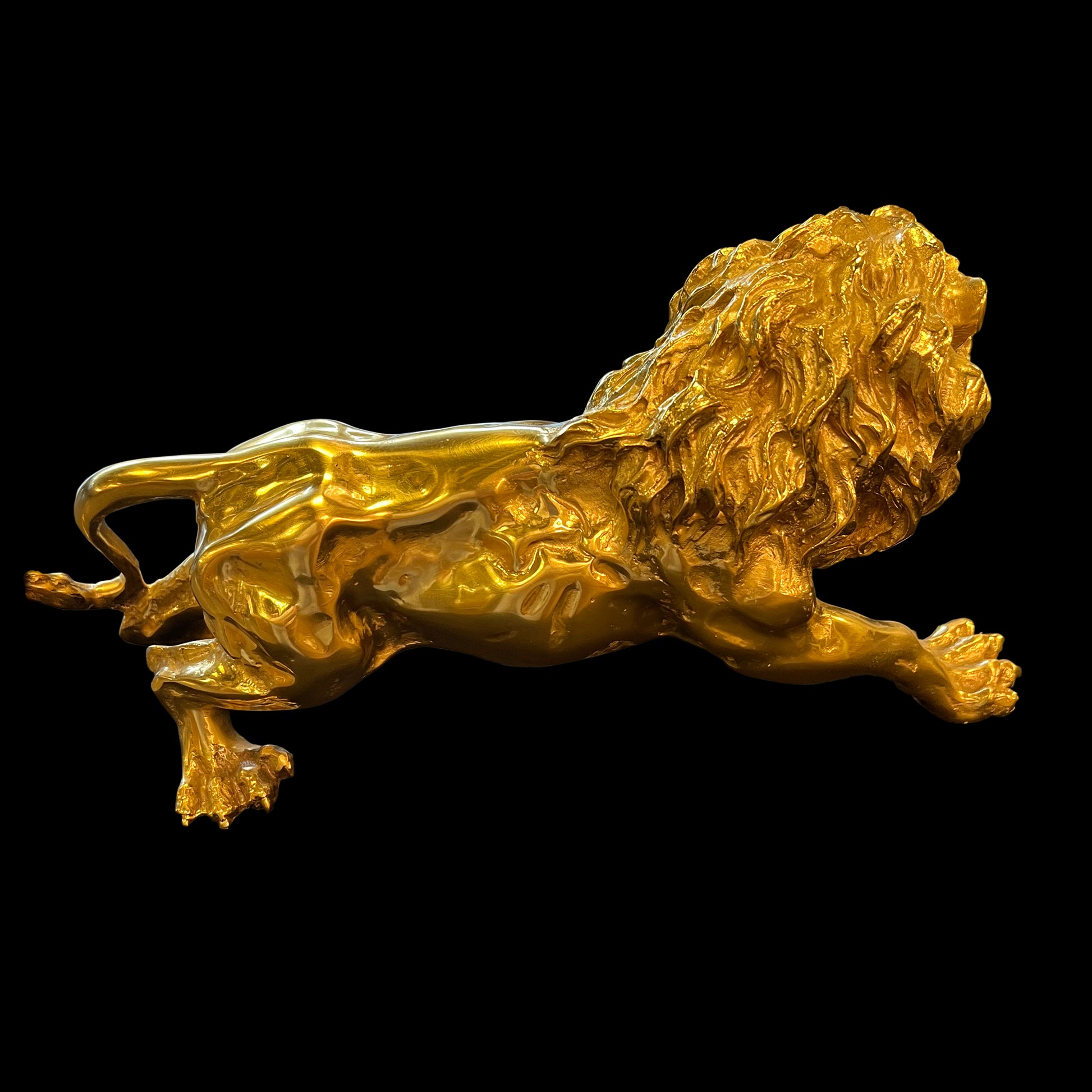  Close-up of the roaring head, tail  and detailed mane of a handcrafted Italian brass lion.