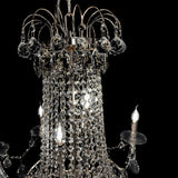 Close-up of precision-cut crystal strands and chrome accents in a luxury chandelier.