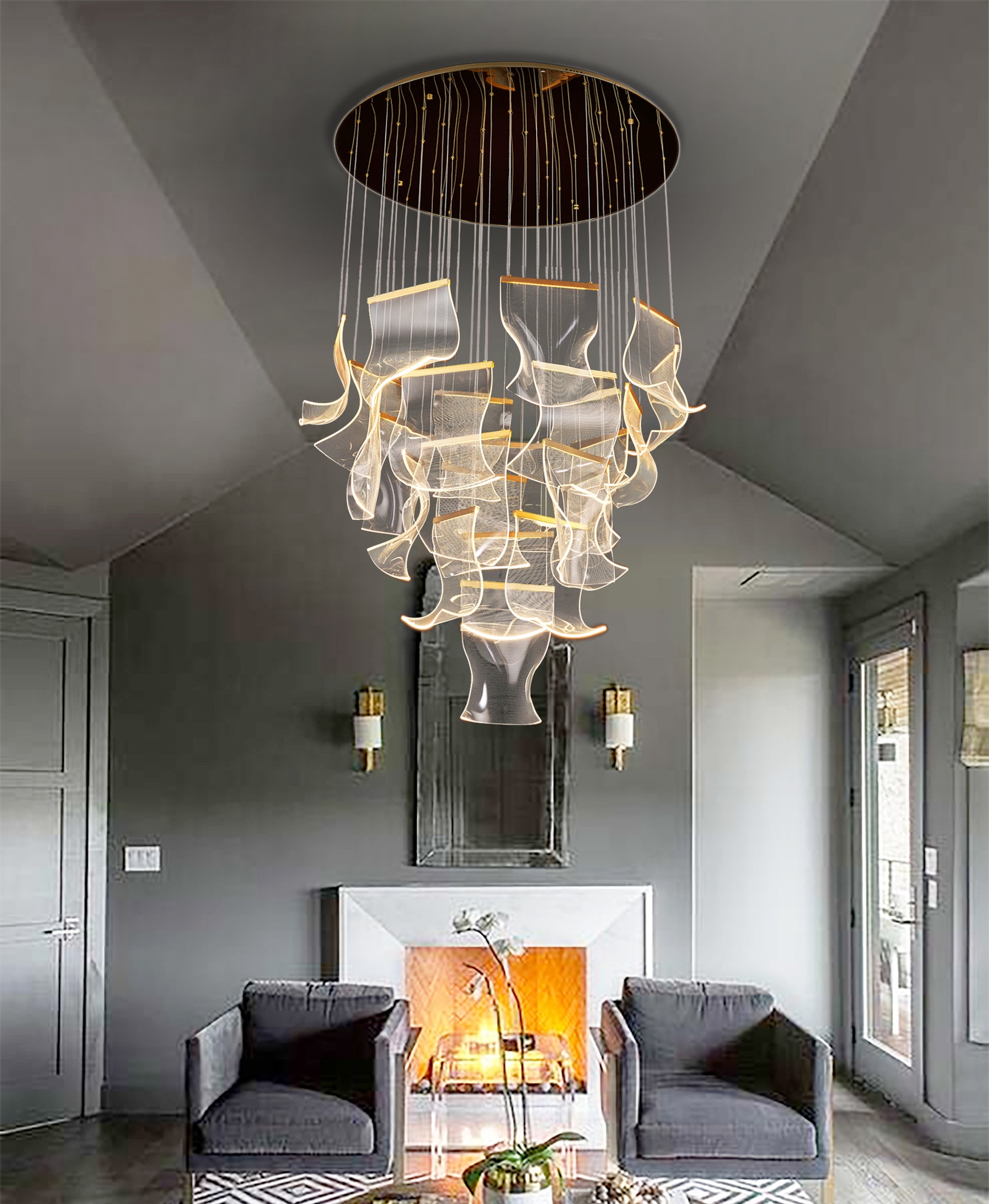  Adjustable and dimmable gold chandelier with sculptural wave panels creating soft ambient lighting in a modern living room.
