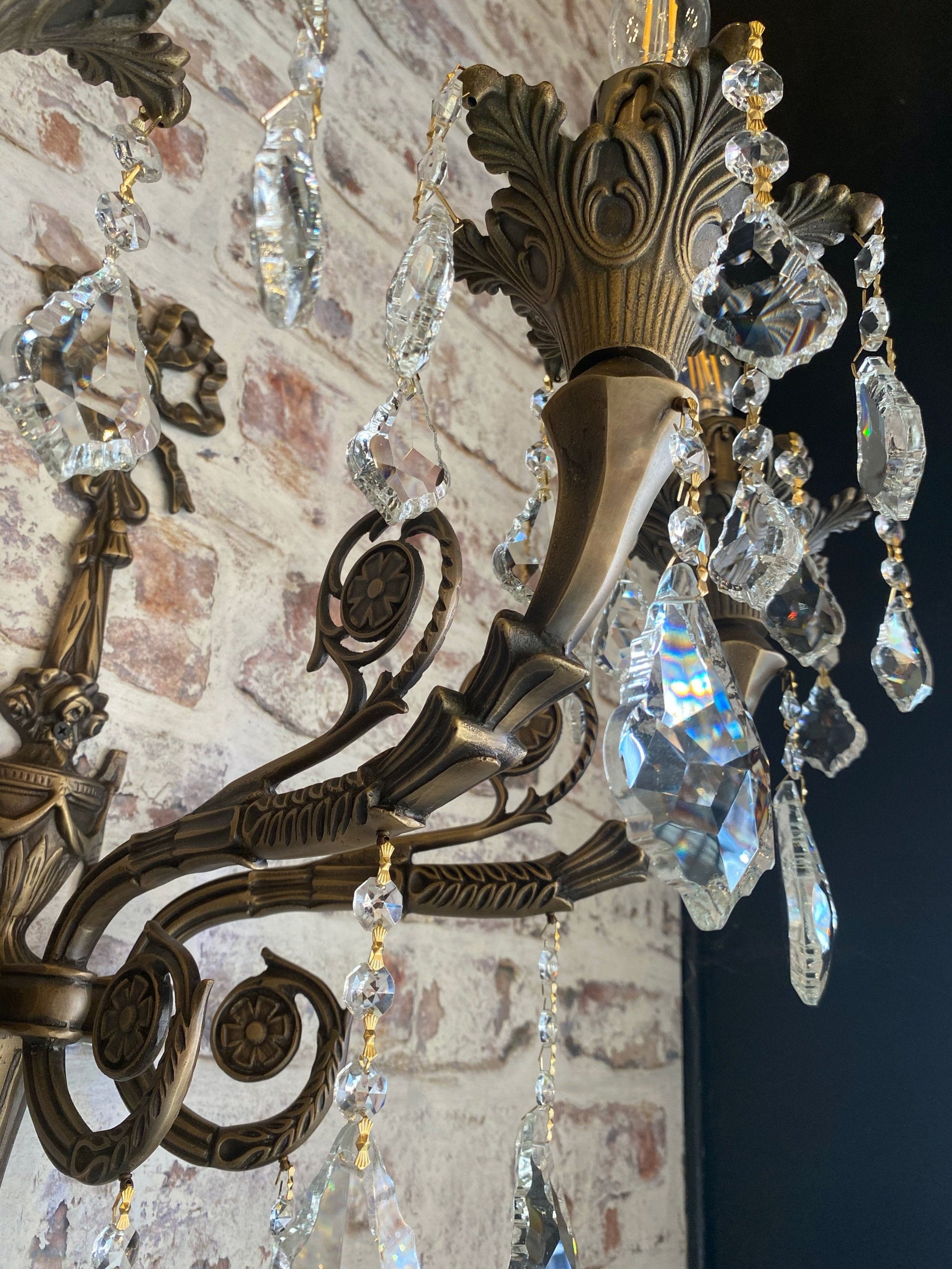 Side angle of Italian brass wall sconce with crystal drops