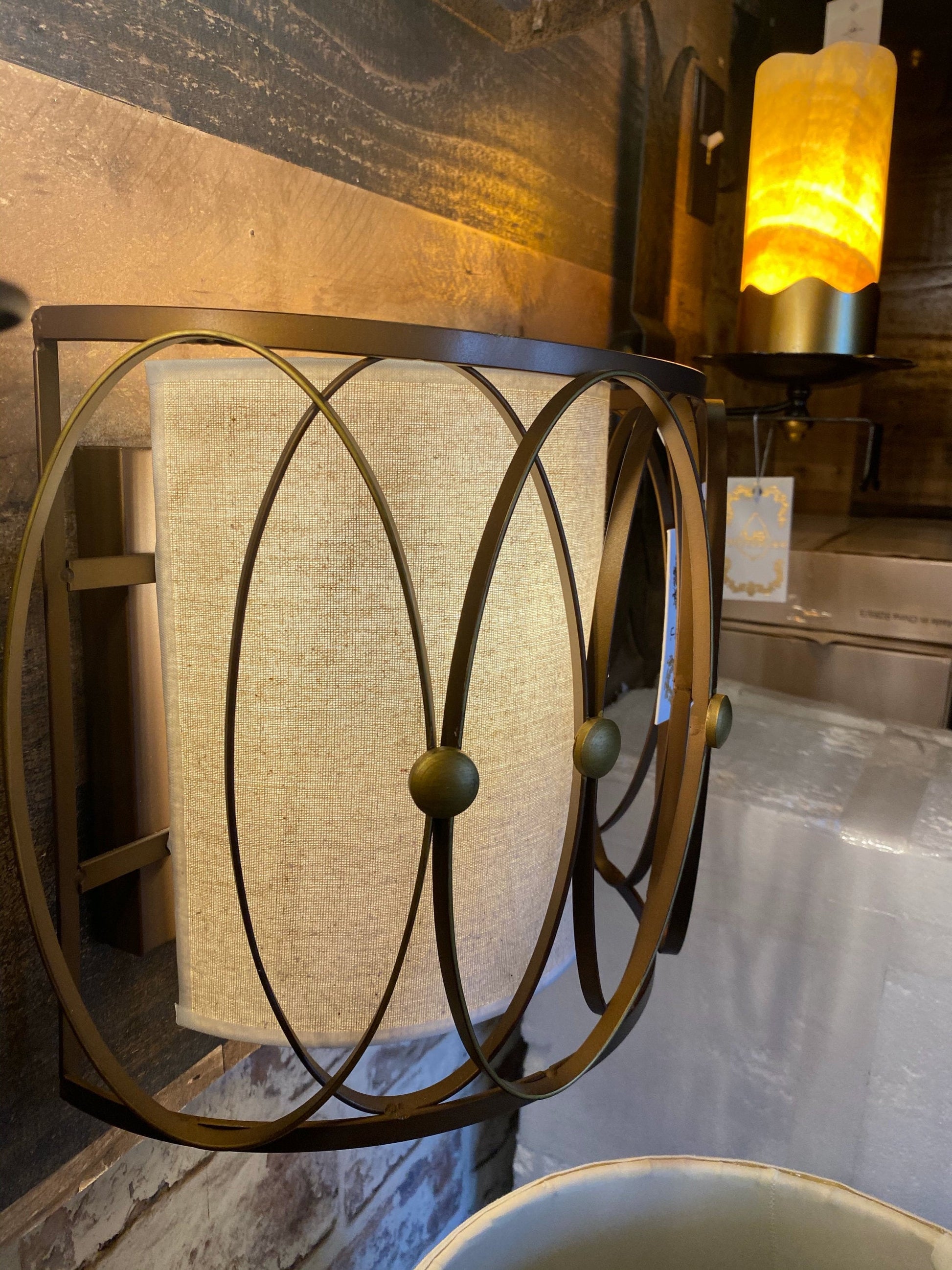 Bronze cage frame detail on wall sconce
