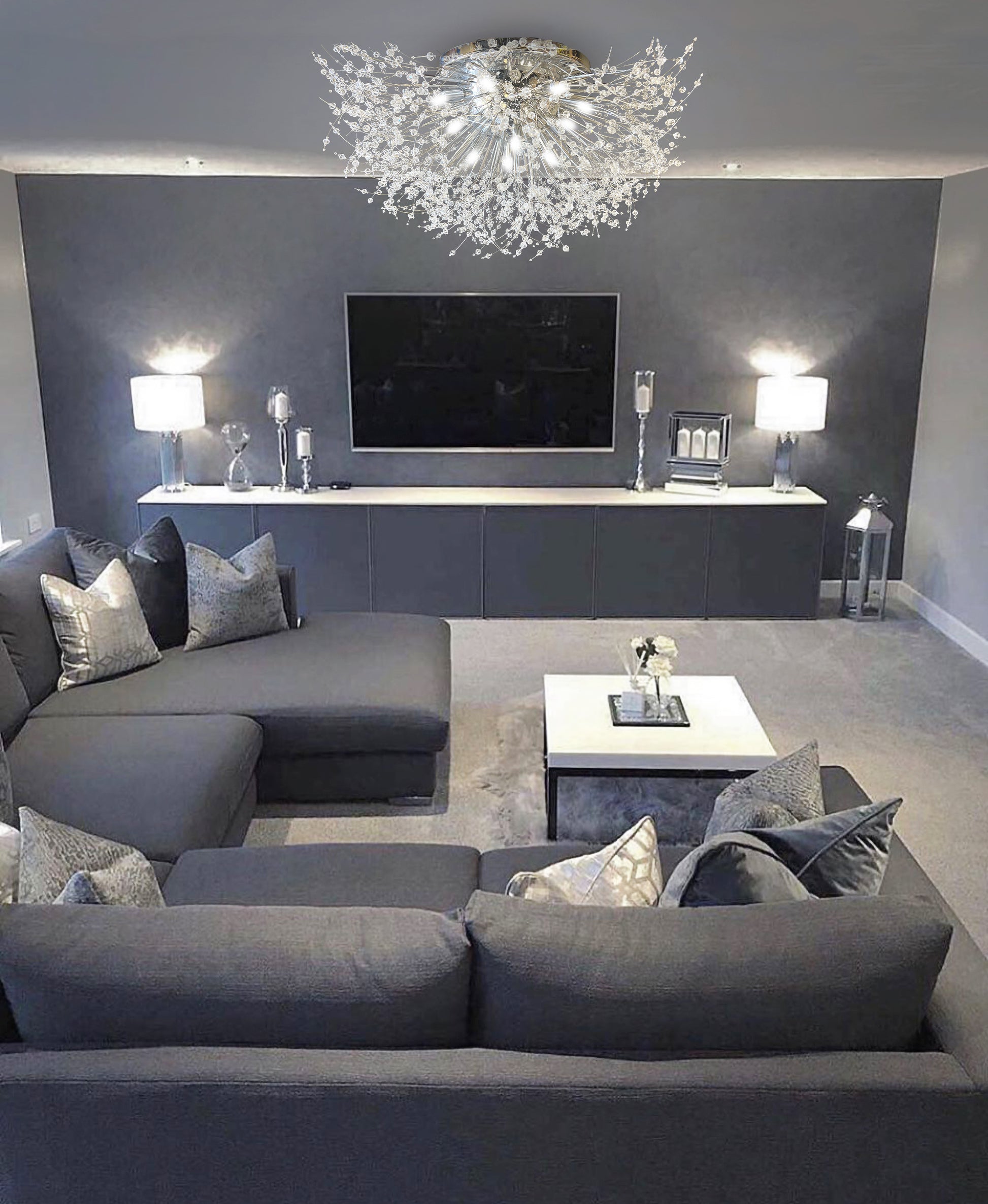 Elegant chrome flush mount chandelier illuminating modern living room interior