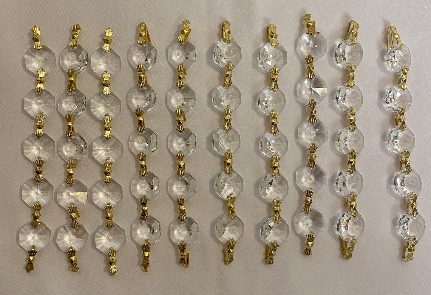 Luxury crystal chandelier strands flat lay detail