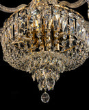 sparkly detailed gold chandelier base with clear hanging crystals reflecting warm light.