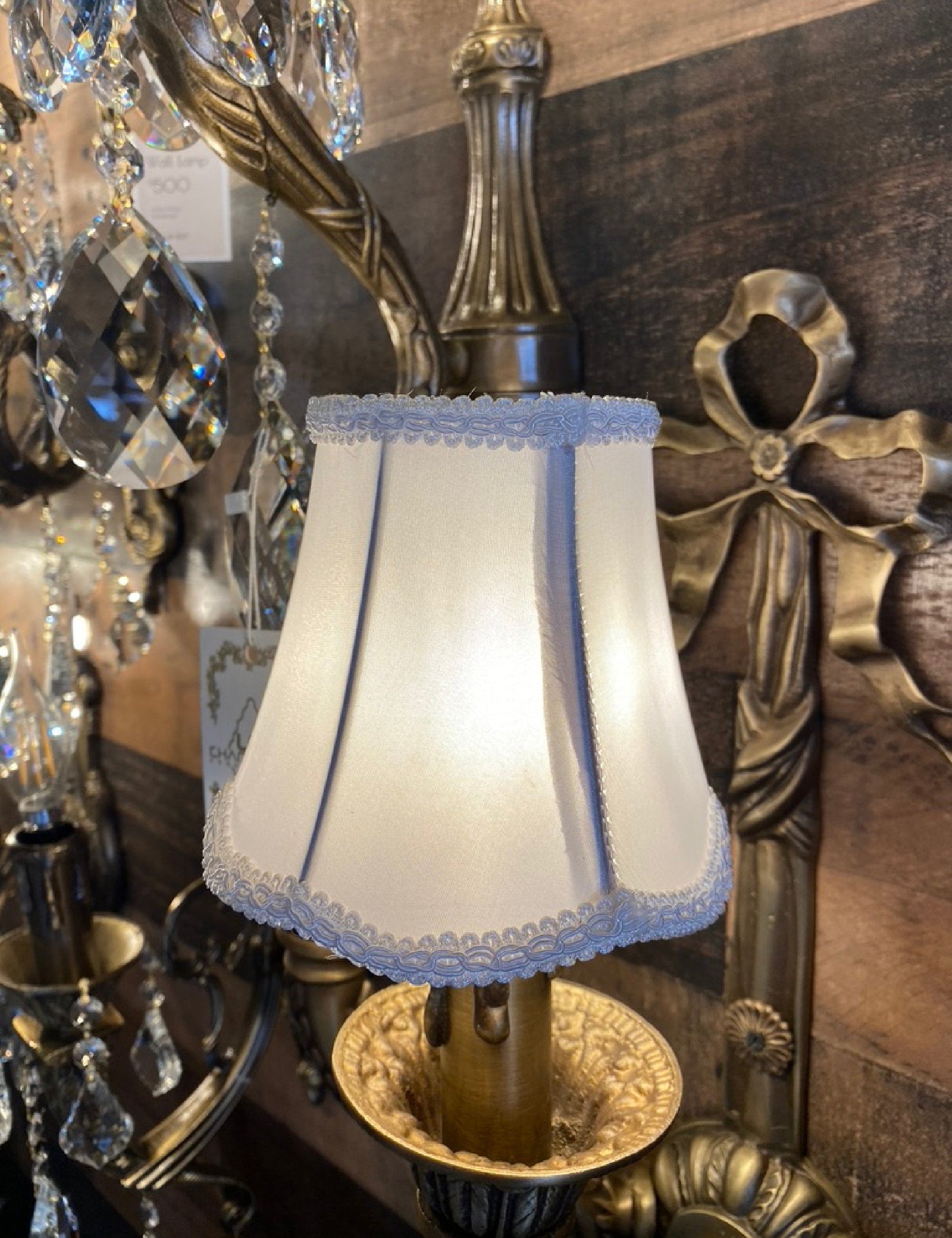 Gray satin clip-on lamp shade with warm ambient glow

