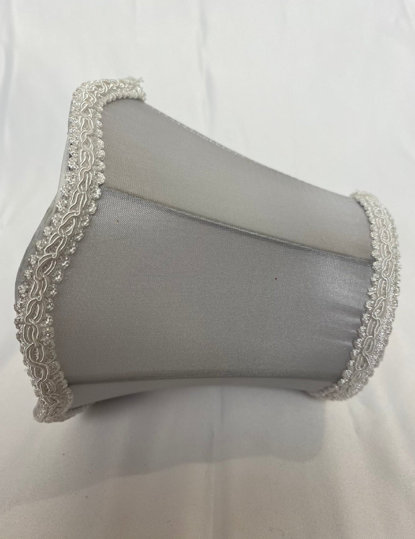 Side view of gray satin clip-on lamp shade