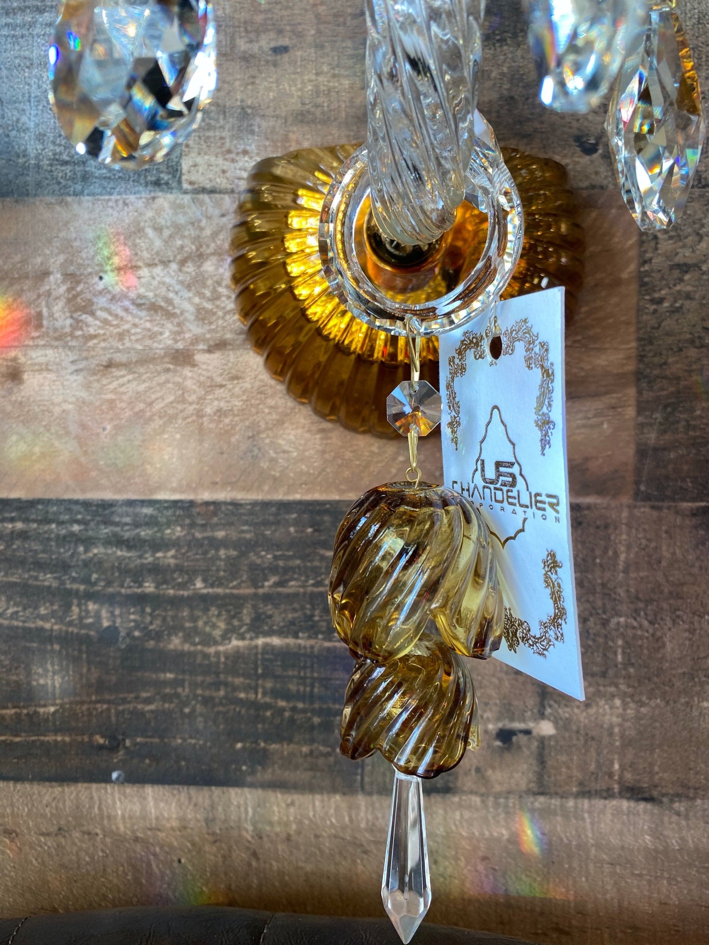 Gold wall backplate detail on handcrafted glass wall sconce