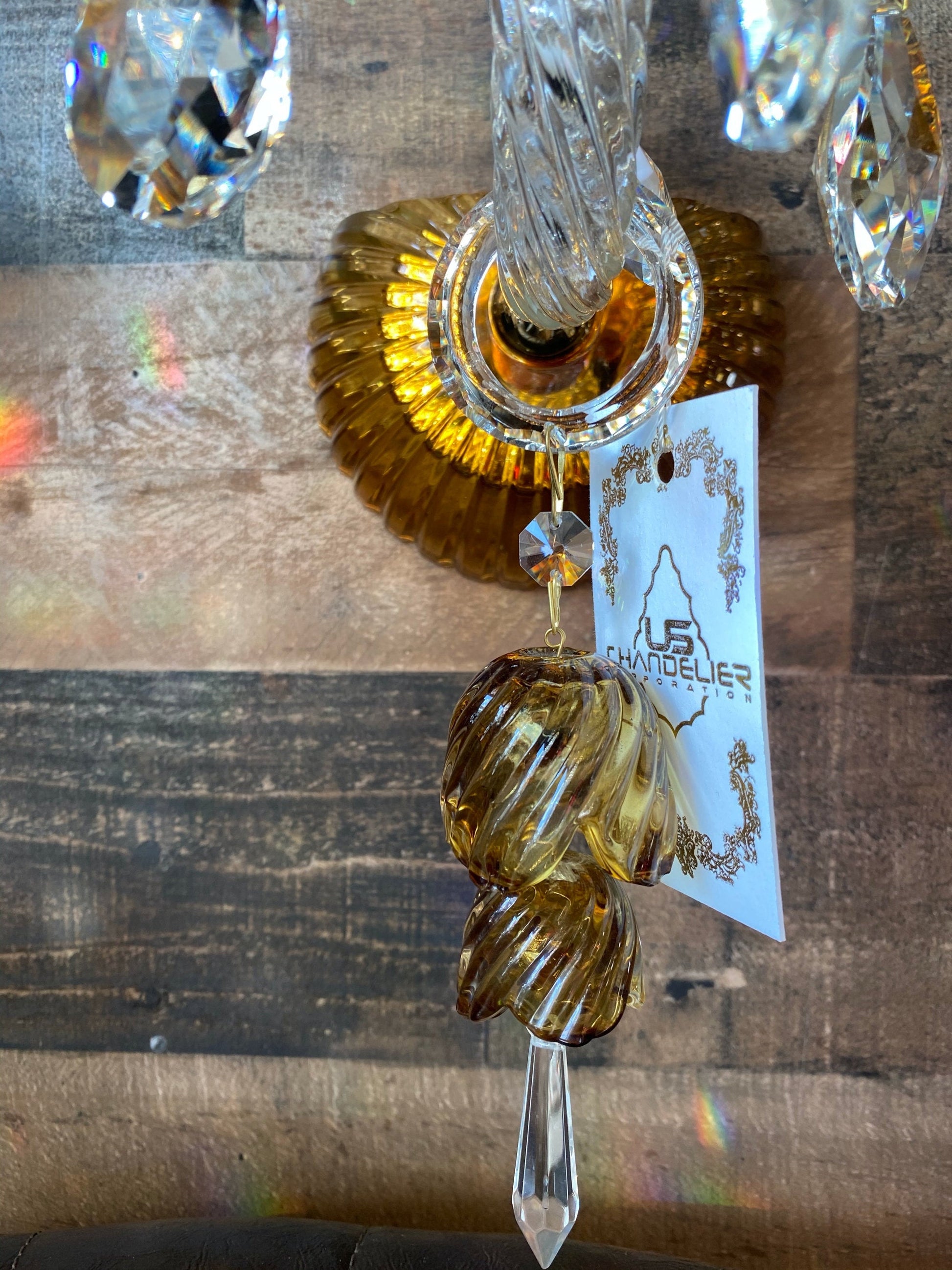 Gold wall backplate detail on handcrafted glass wall sconce