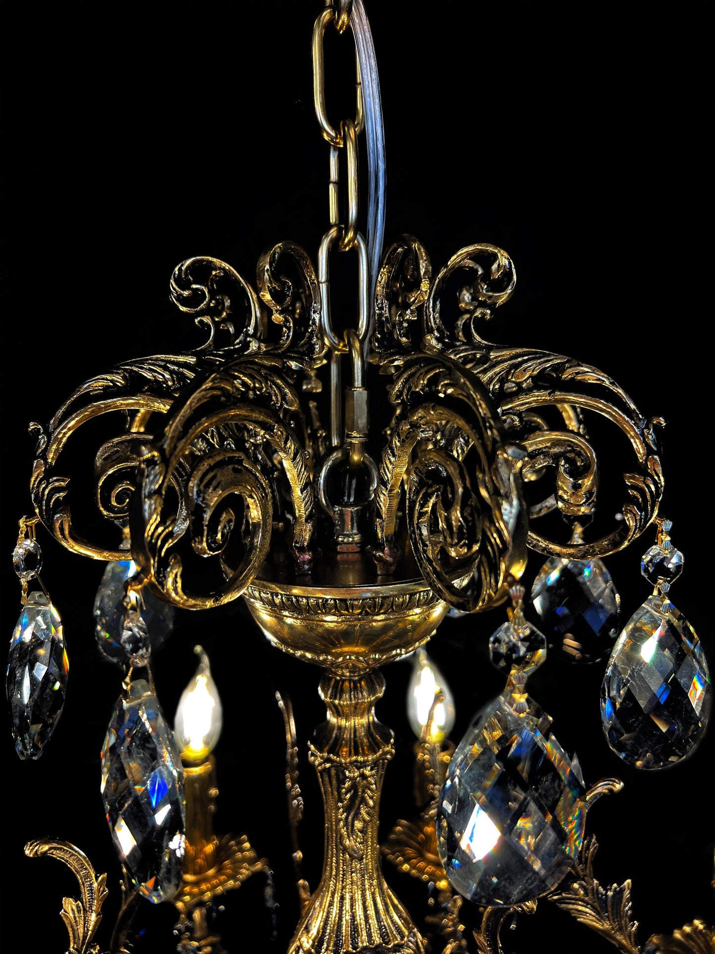 Handcrafted Italian brass chandelier crown with ornate scrollwork and crystal drops