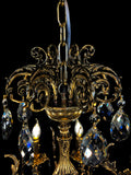 Handcrafted Italian brass chandelier crown with ornate scrollwork and crystal drops
