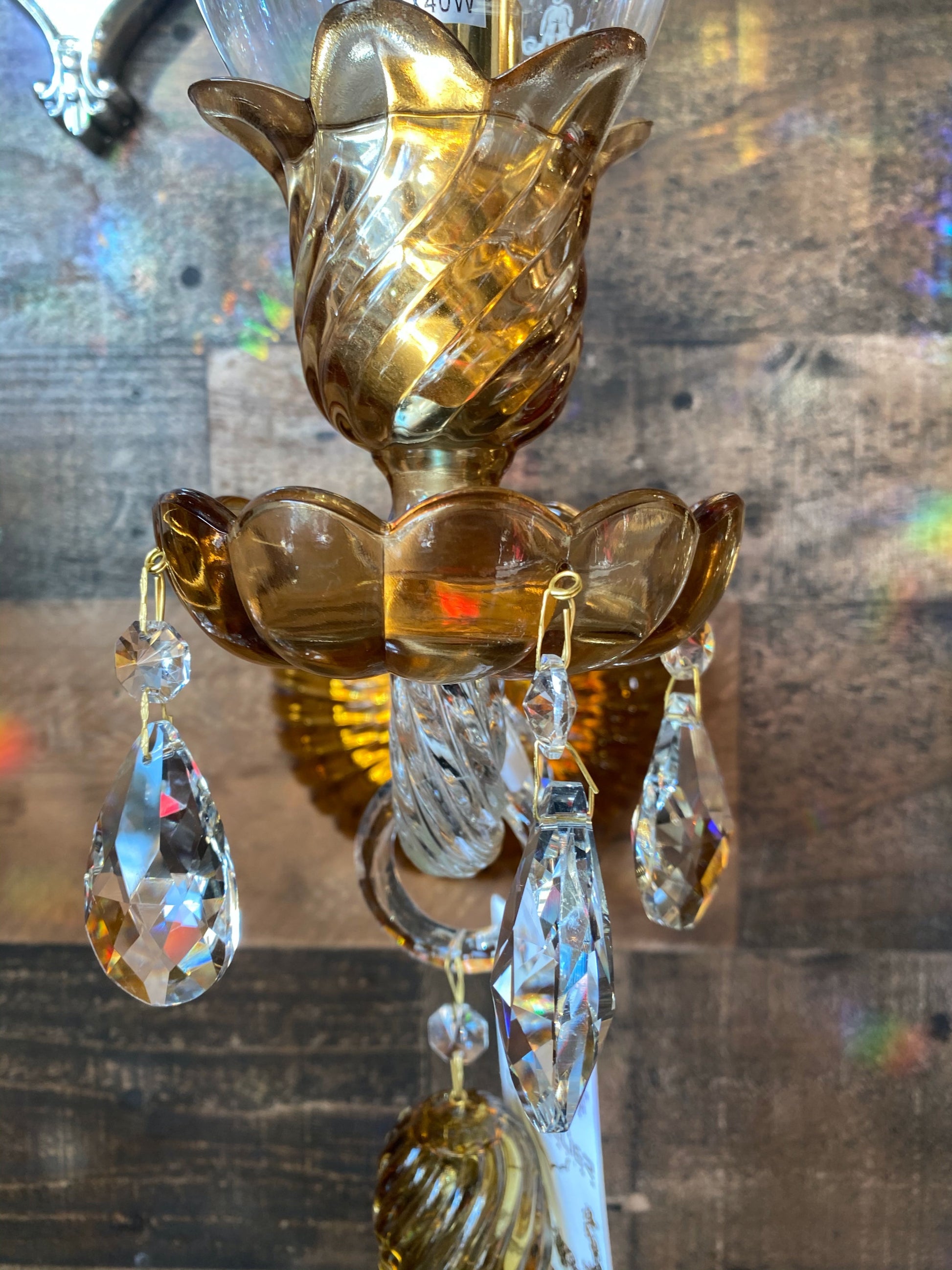 Curved handcrafted glass arm with gold detailing wall sconce
