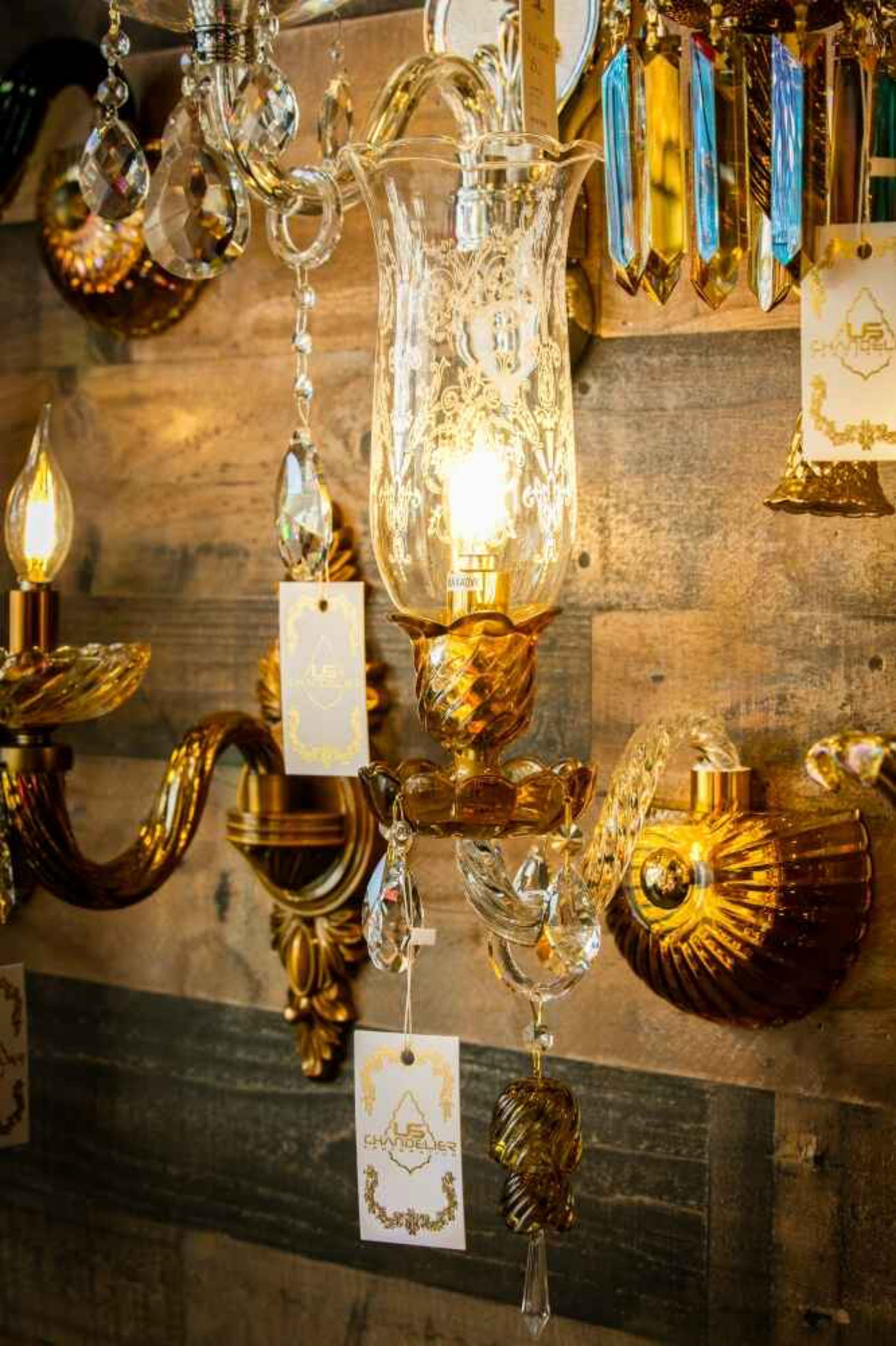 Classic Italian glass wall sconce installed with warm ambient lighting