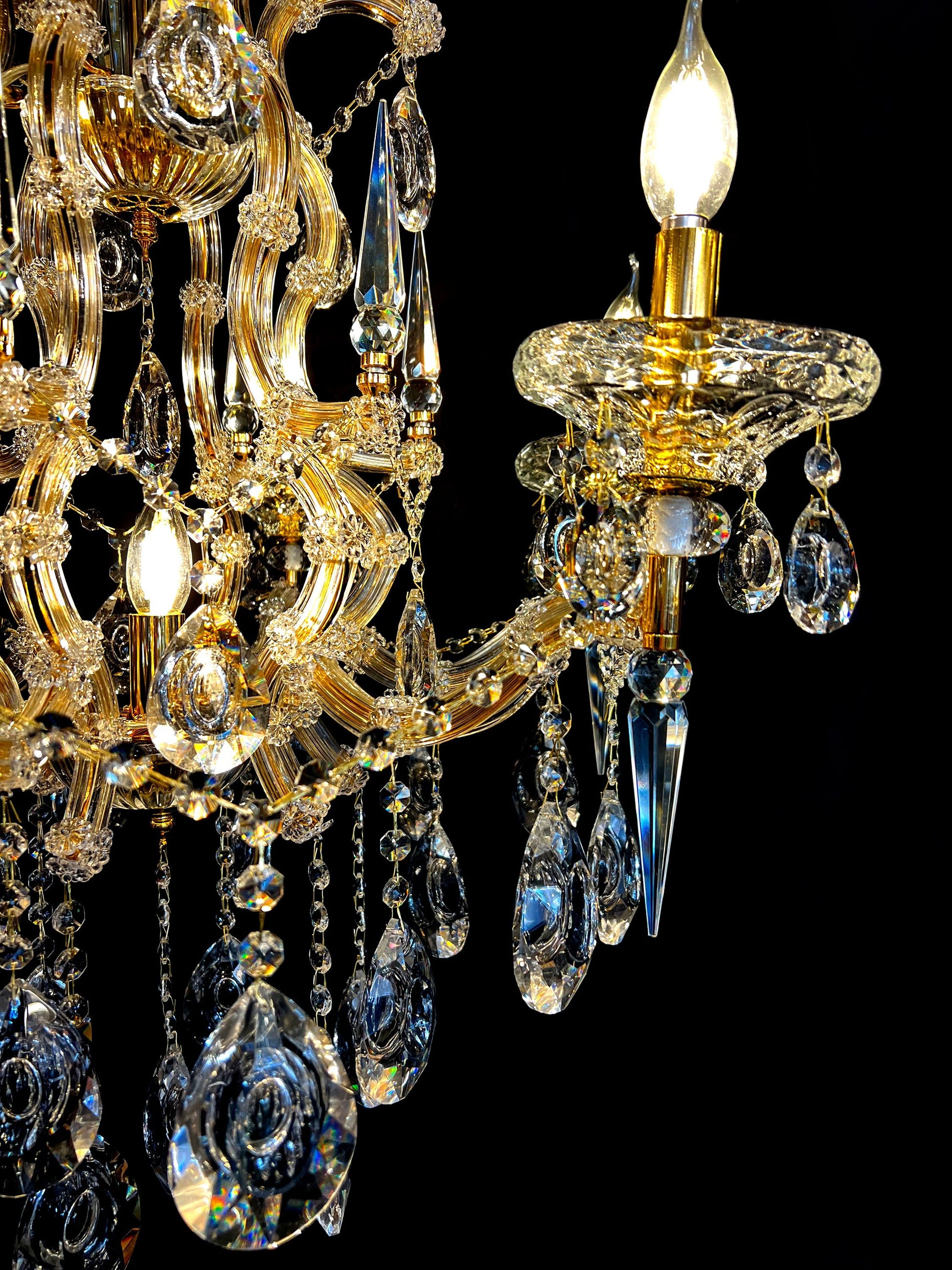 Close-up of the glass arm and teardrop lead crystal on Maria Theresa chandelier.