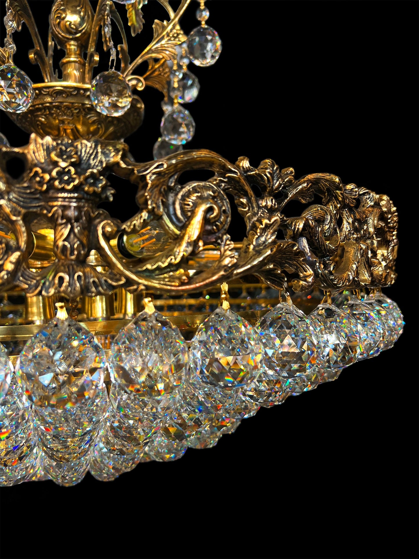 Ornate brass chandelier with layered crystal bowl design