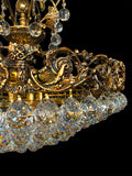 Ornate brass chandelier with layered crystal bowl design