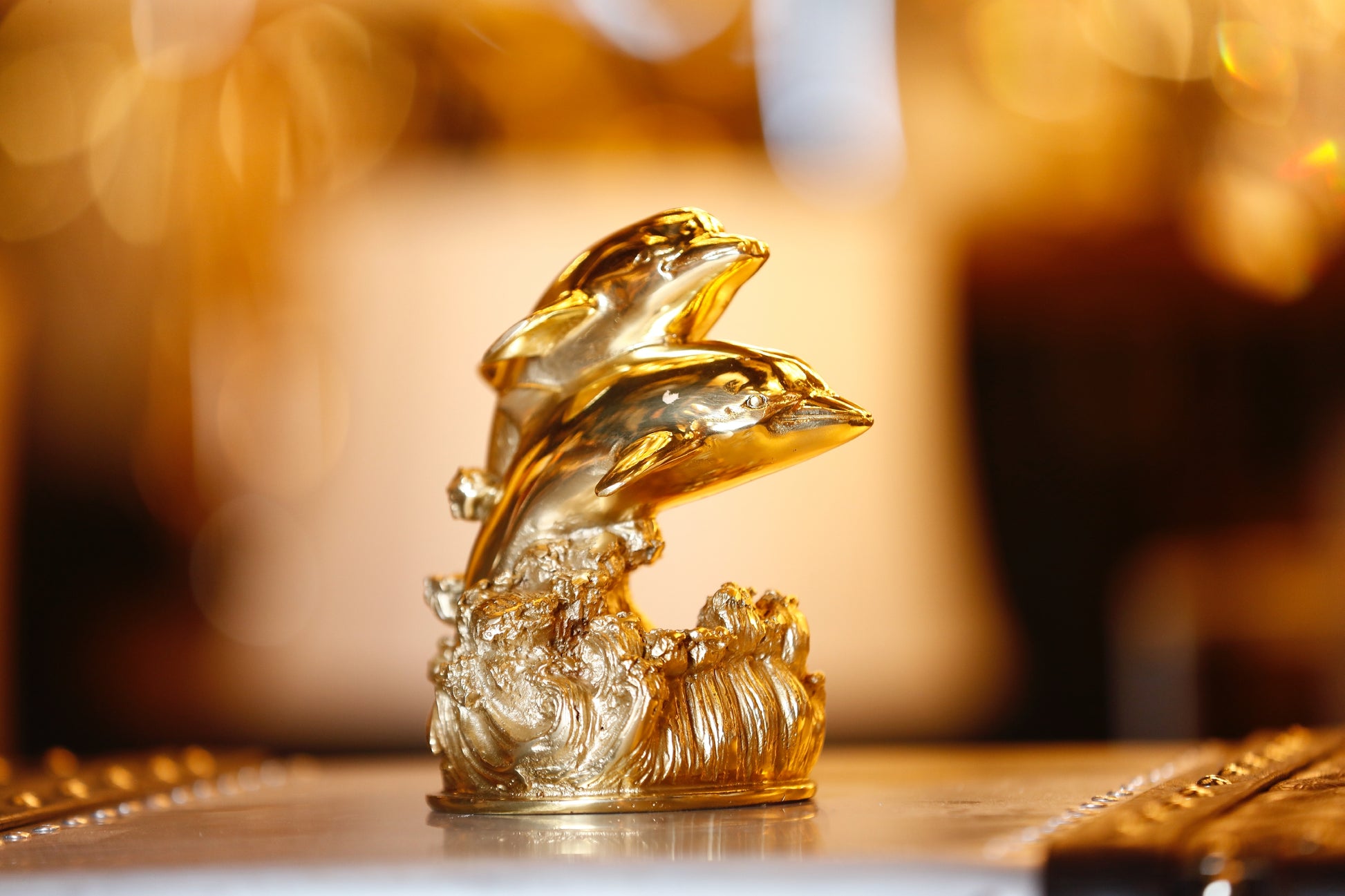 Luxury brass dolphin sculpture side detail artisan finish