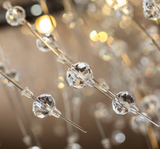  Close-up of shimmering crystal branches and chrome finish