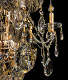 Close-up view of precision-cut crystal drops and gold finish chandelier arms