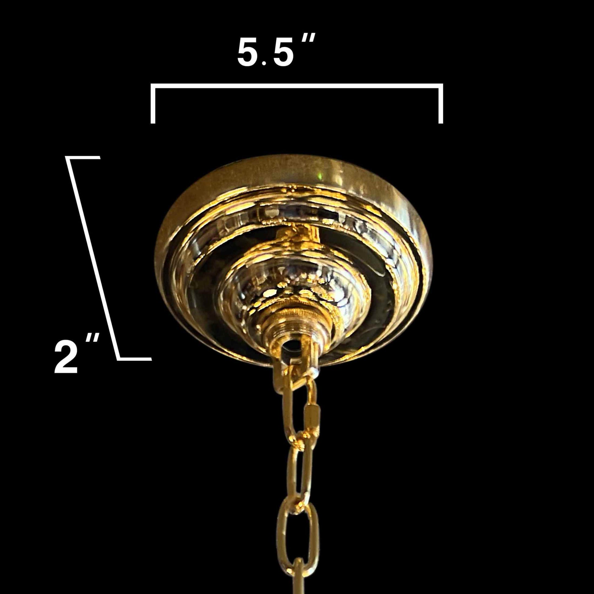 Close-up of the gold canopy and chain detail on a Maria Theresa chandelier.
