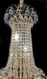 Upper section of chandelier featuring teardrop and crystal chains