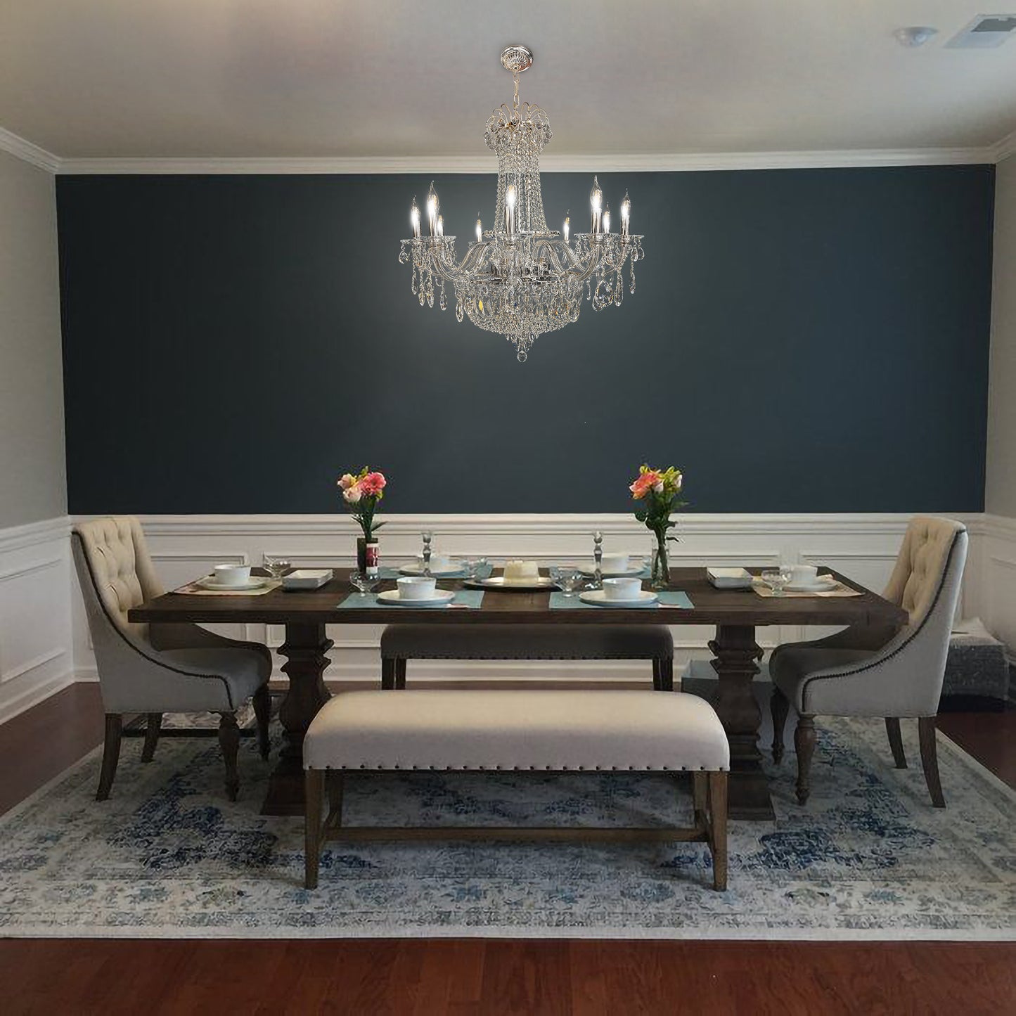 Modern chrome empire chandelier enhancing a high-ceiling foyer with elegant lighting